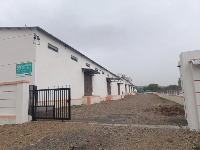 Real StowNest Storage warehouse facility exterior in Pune with signage and secure gated entrance