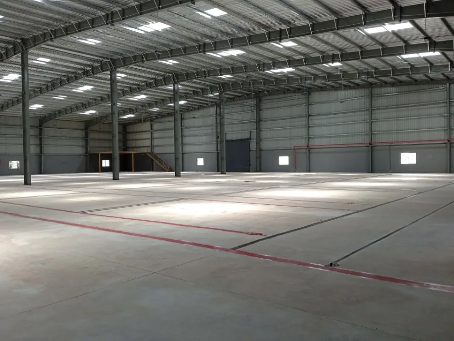 Real StowFlex warehouse floor with high-bay steel structure and lane-marked concrete flooring